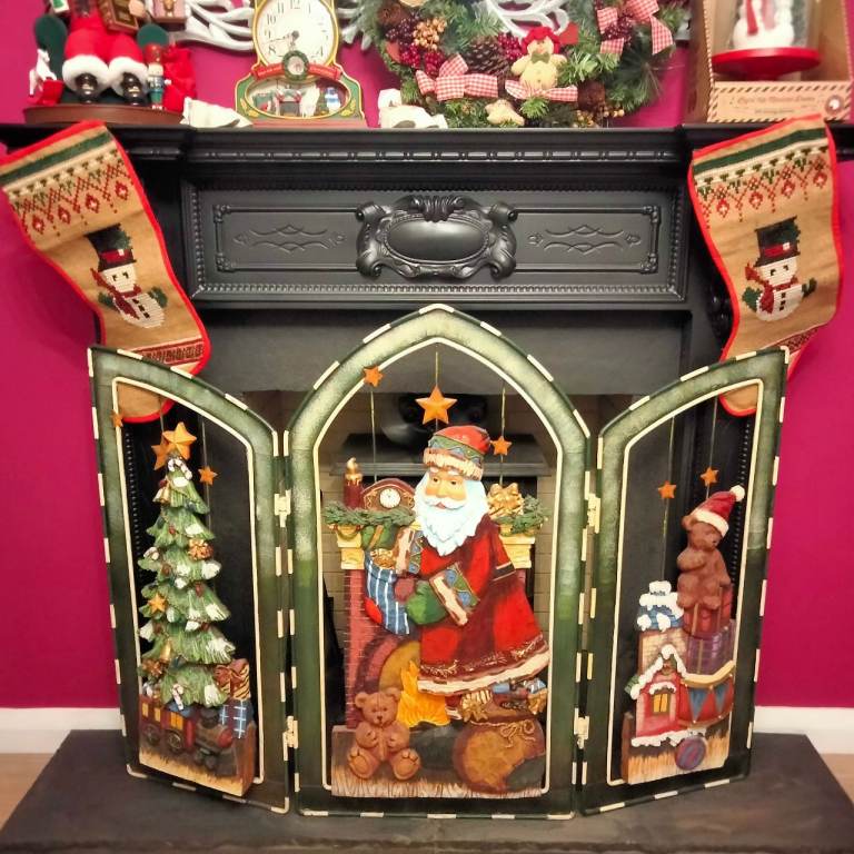 Christmas themed fireguard, metal frame with relief images. £200 ONO