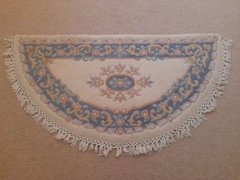 Chinese semicircular blue and cream wool rug 