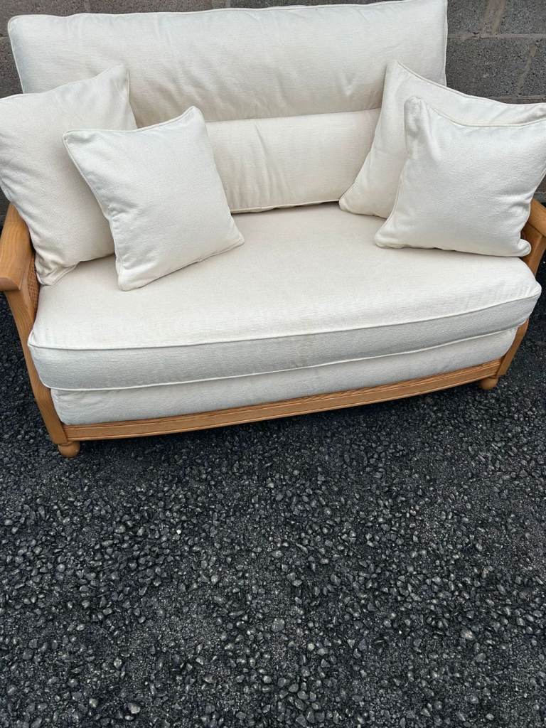 Two Ercol Bergere 2 seater sofas