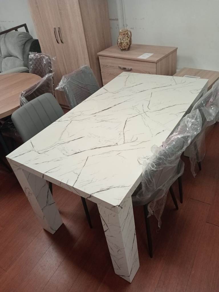 Brabd new ex display wood marble effect table and 4 grey leather chairs 