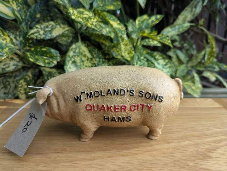 W Moland's and Son cast iron pig money box