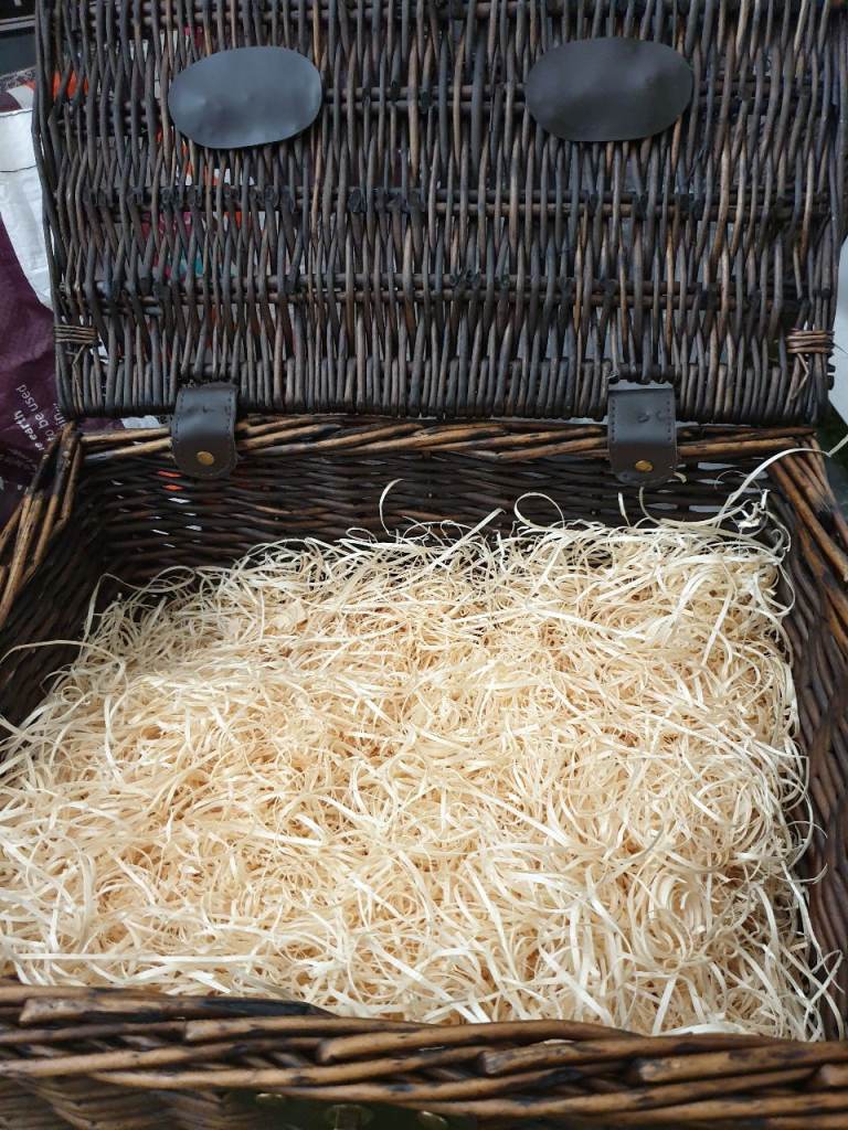 Wicker hamper with leather like straps