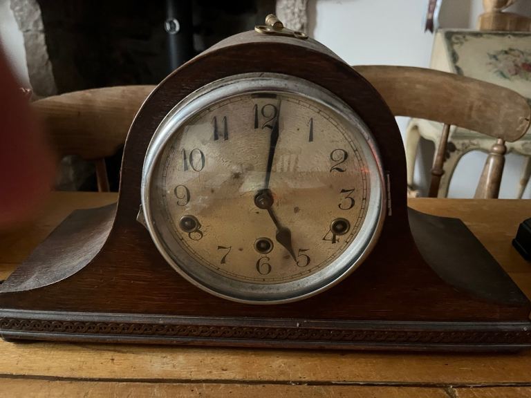 Antique clock chimes and original key 
