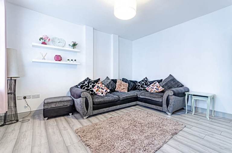 Beautiful sectional couch and matching footstool for immediate collection (good condition)