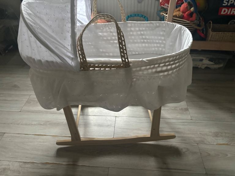 embroidery detail wicker moses basket 