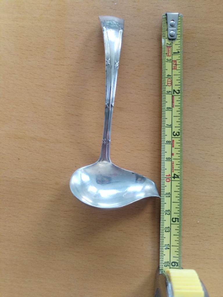 Ornate vintage silver plated gravy ladle