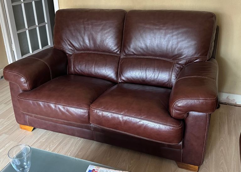 Two chocolate leather sofas