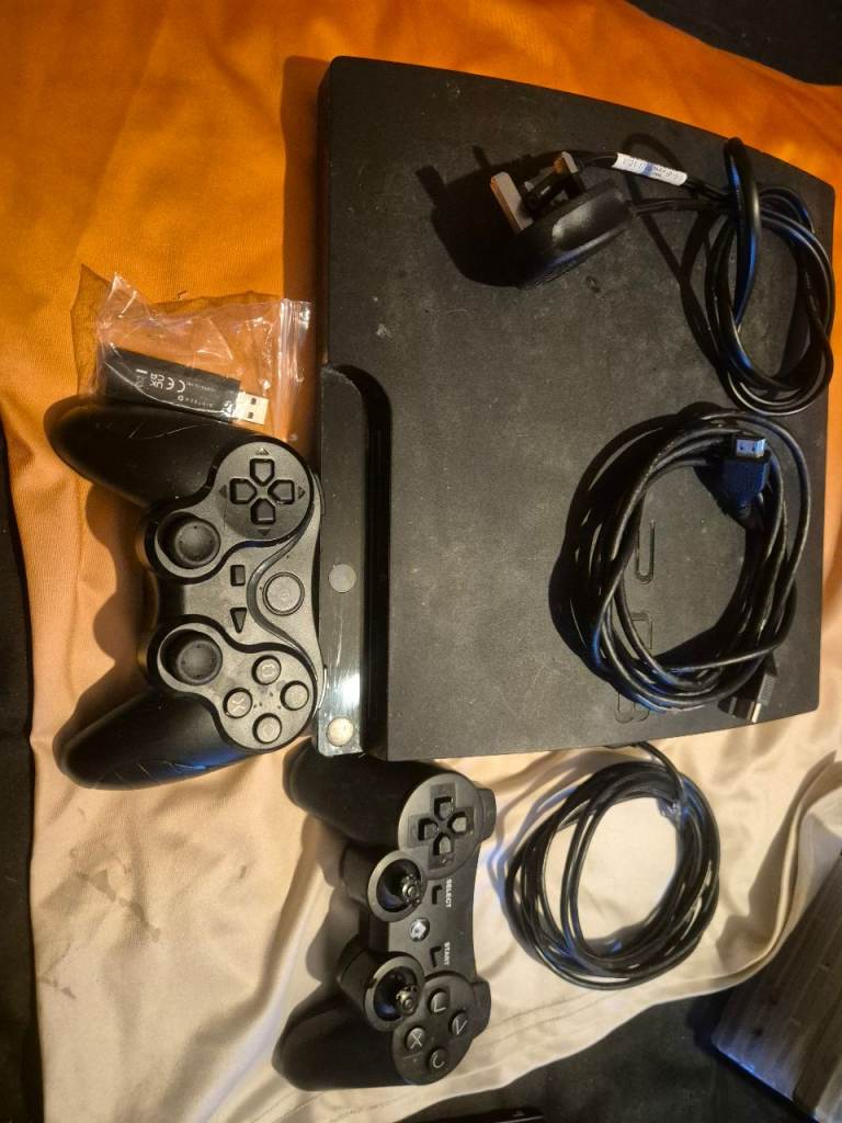 Sony PlayStation 3 Console with 2 Controllers and Games