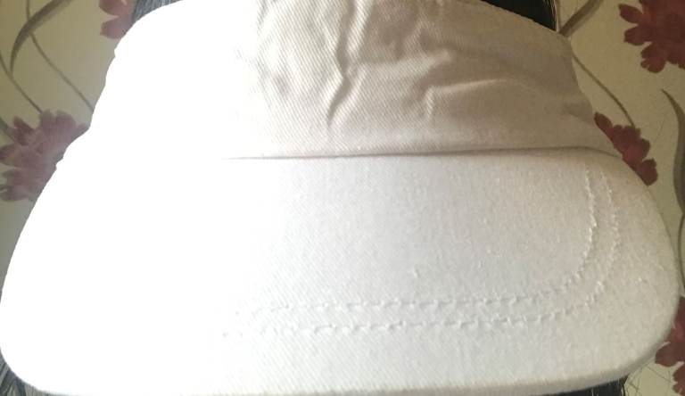 headless white cap