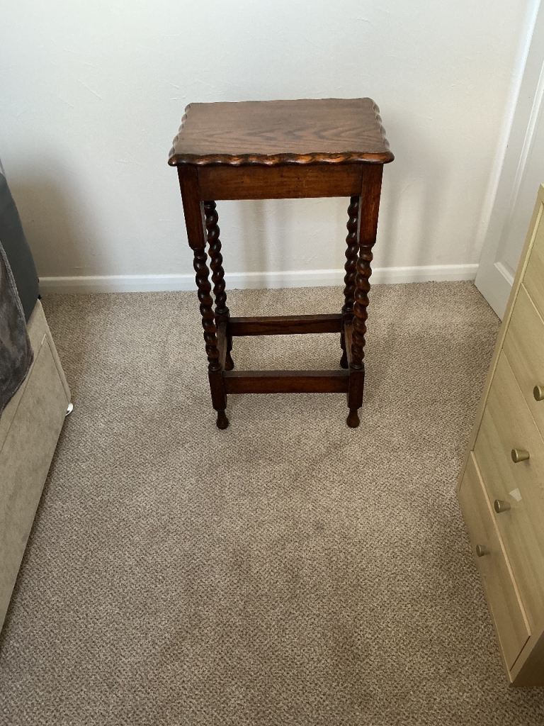 Antique indoor wooden plant stand.