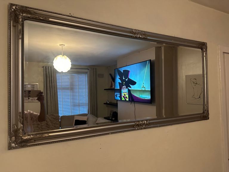 Antique silver framed mirror