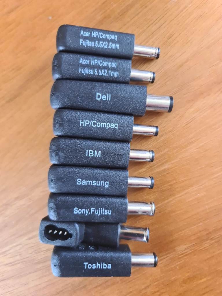 Universal laptop charger connector tips used to adapt a power supply to fit different laptop models