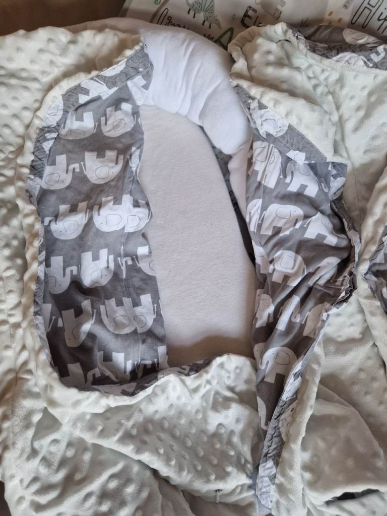 Baby nest for sleeping or comfort.