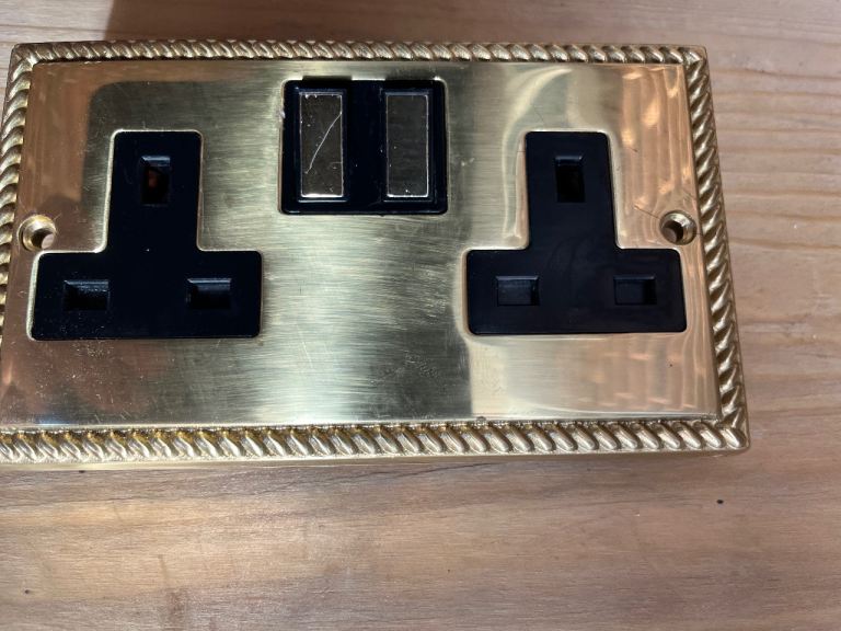 Brass coloured wall sockets traditional design