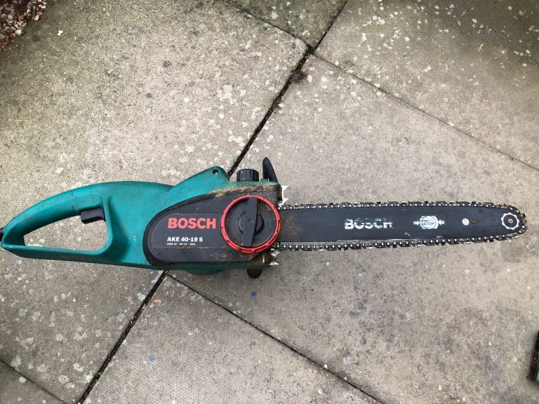 Bosch Chainsaw with Protective Trousers and Visored Helmet 