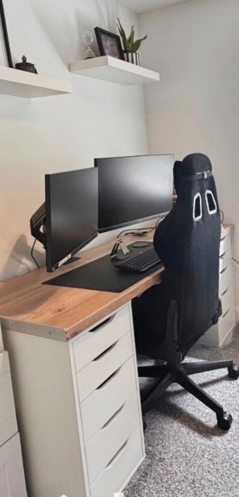 X2 monitor screens with adjustable arms.