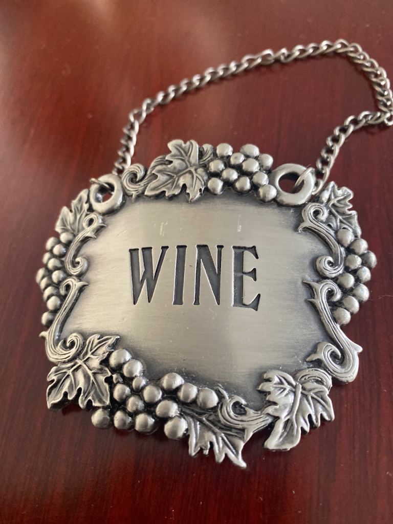 Large metal fruit design wine decanter tag 