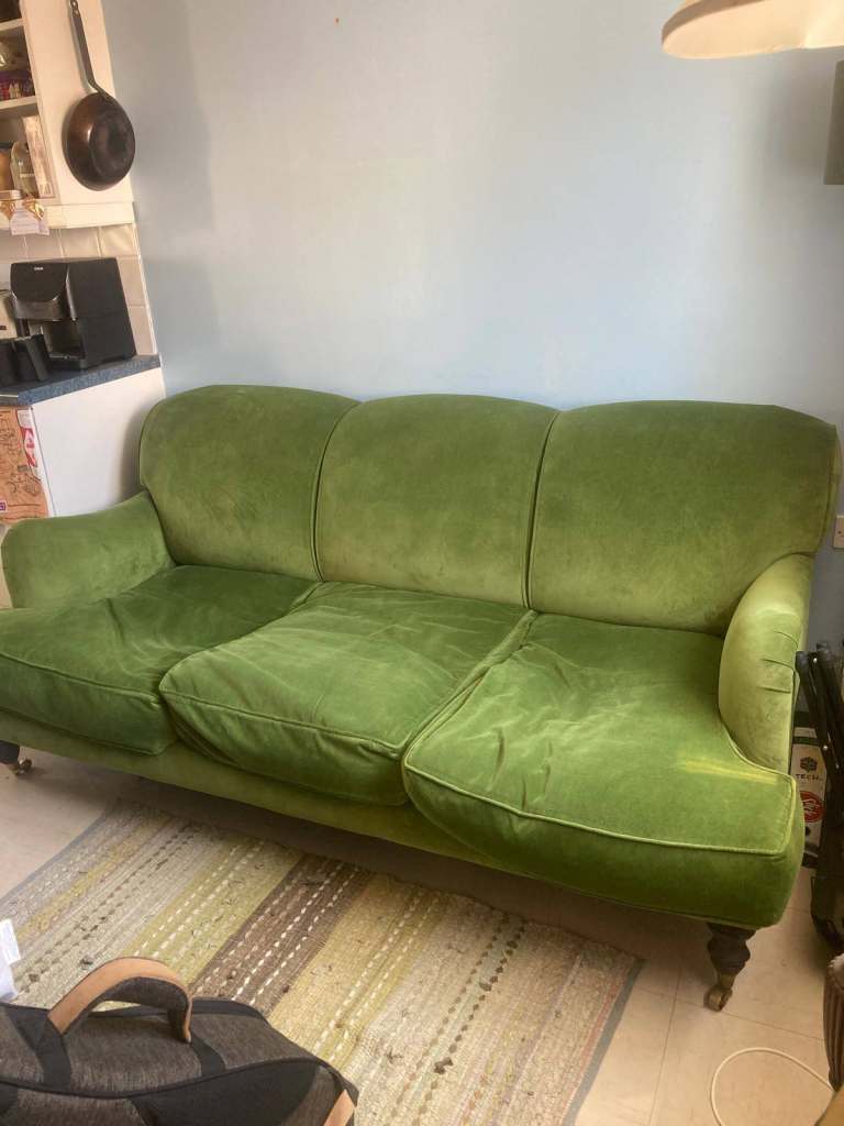 Velvet green three seater sofa
