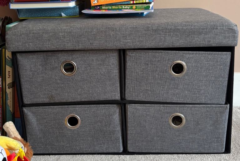 Four drawer grey storage ottoman