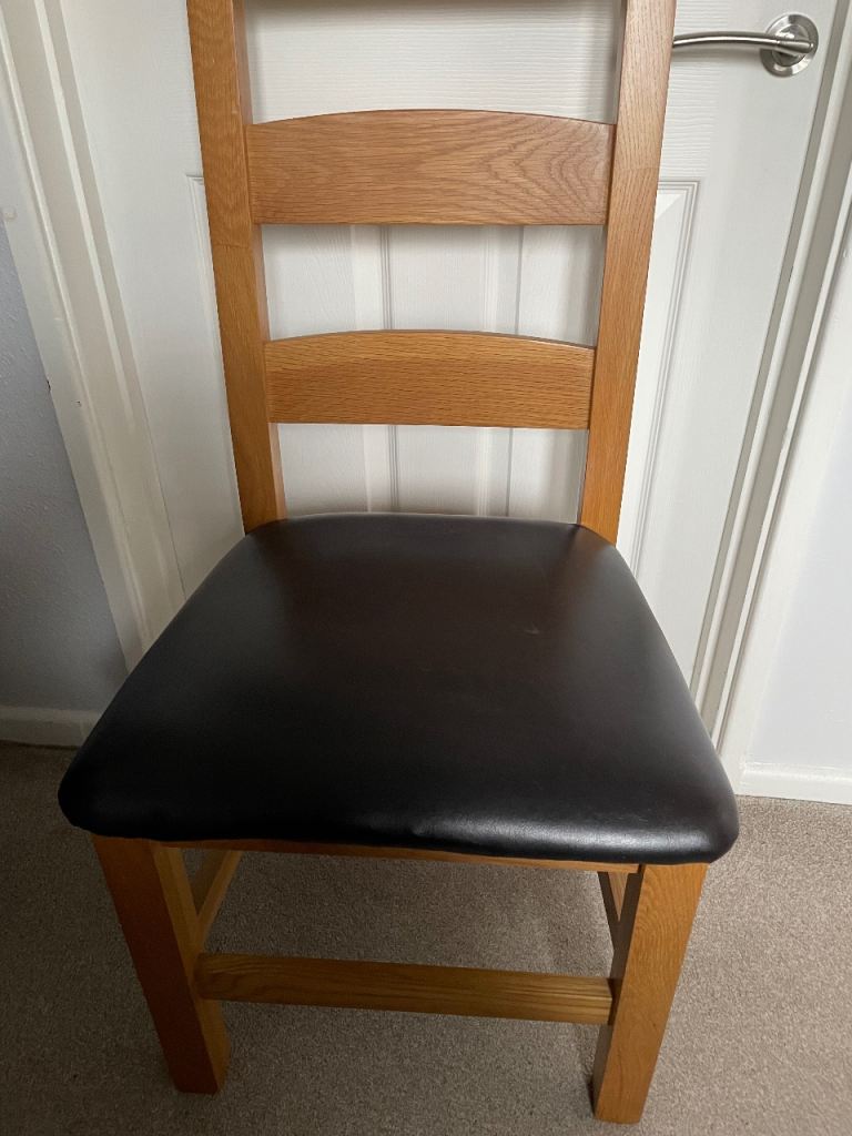 Solid oak dining chairs x 2