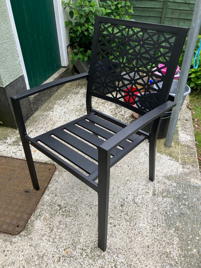  4 black metal chairs