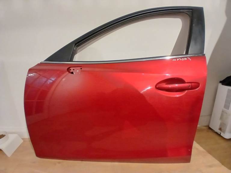 Mazda 3 passenger door