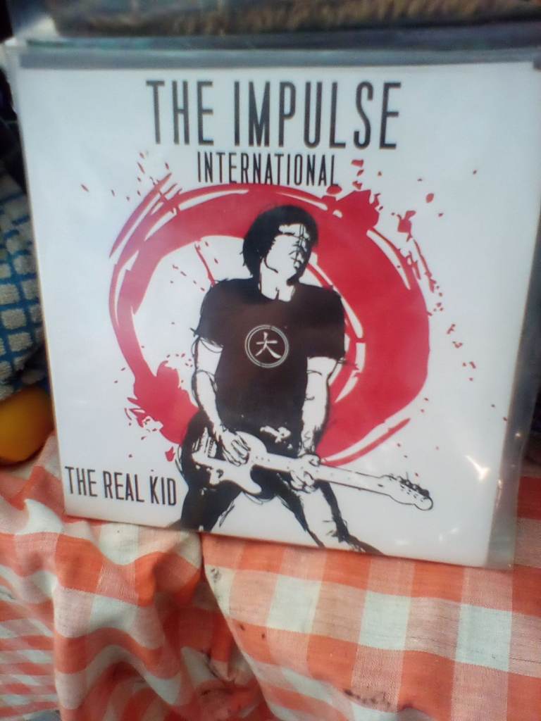 The impulse international,7 inch single,the real kid.alternative rock punk.
