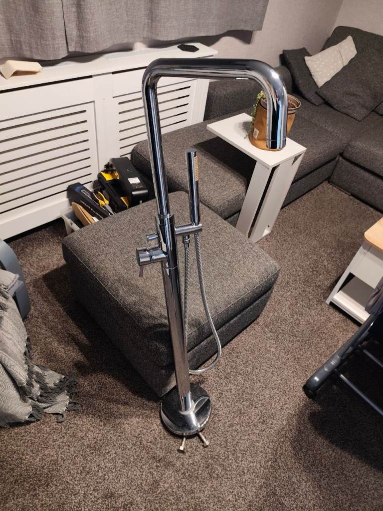 Freestanding tap and shower attachment used as new