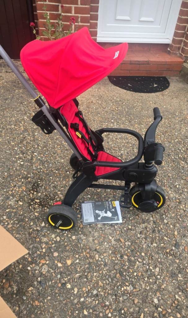 Red Doona Liki Trike - Compact folding tricycle with parent handle
