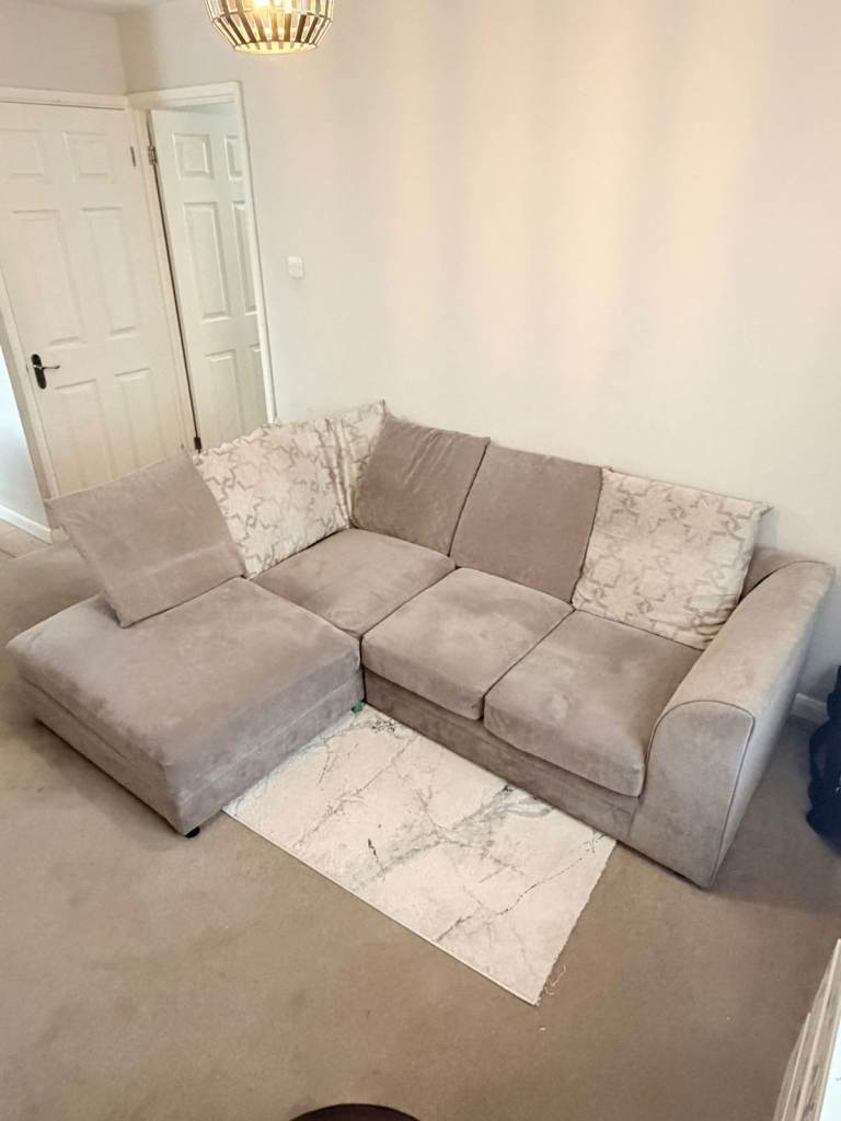 Comfortable Beige Corner Sofa with Floral Cushions