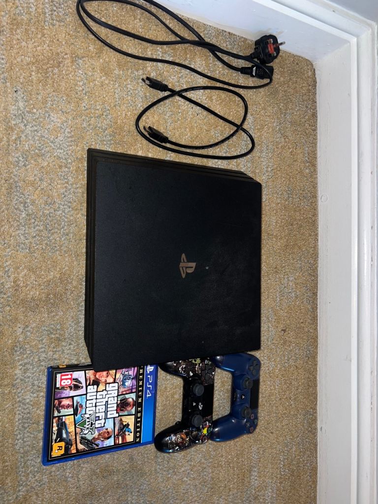 PS4 Pro 1TB + 2 Controllers + GTA V – Works Perfectly