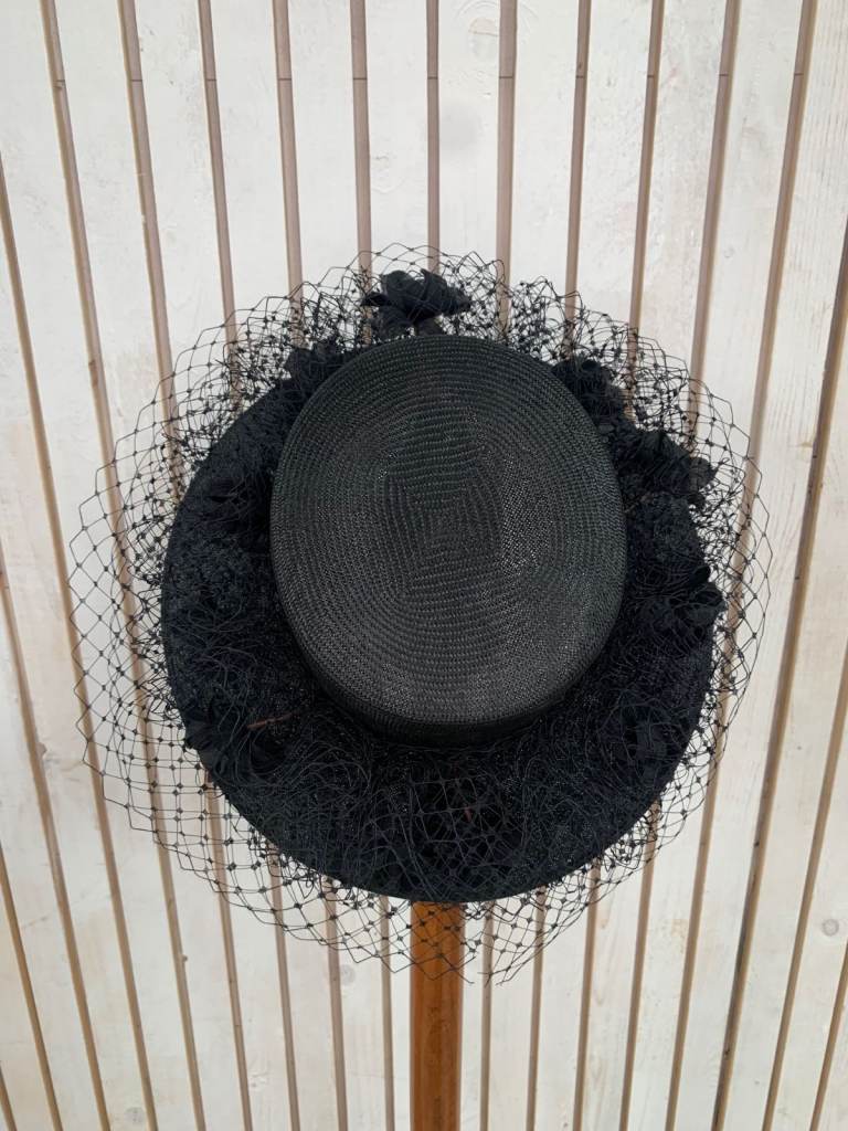 Graham Smith floral fascinator with a wide brim.