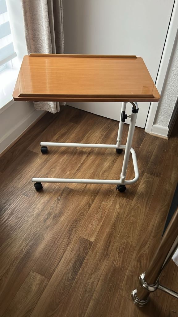 Adjustable medical bed table on wheels 