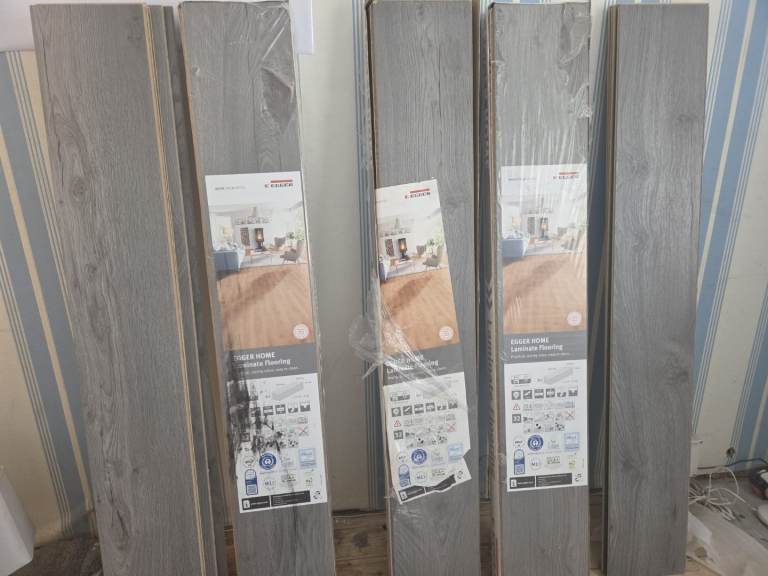 ROUGHLY 6 PKTS 12MM GREY EGGER LAMINATE FLOORING  
