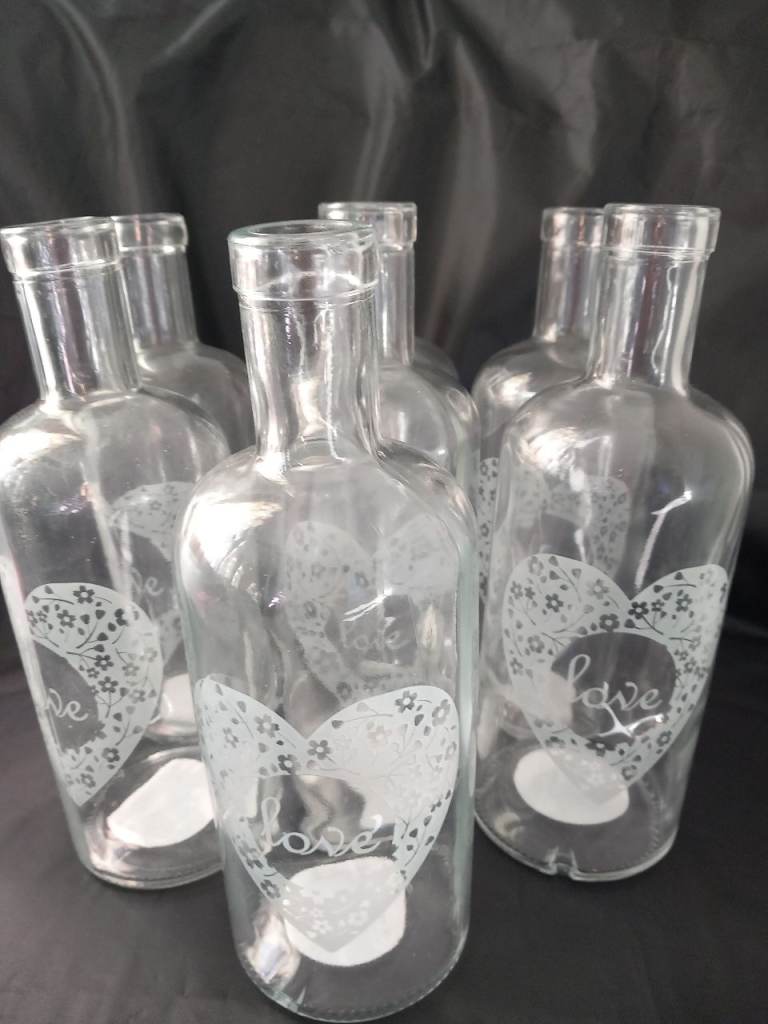 8 glass bottles/vases