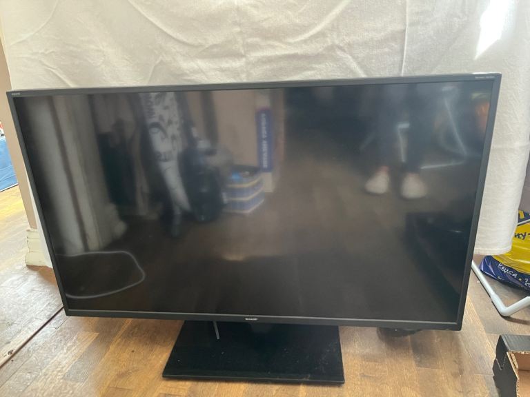 Sharp smart tv with feet and remote