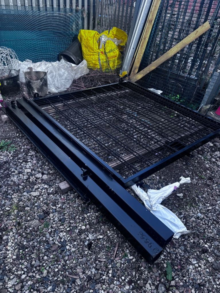 Steel security gates with posts, unused