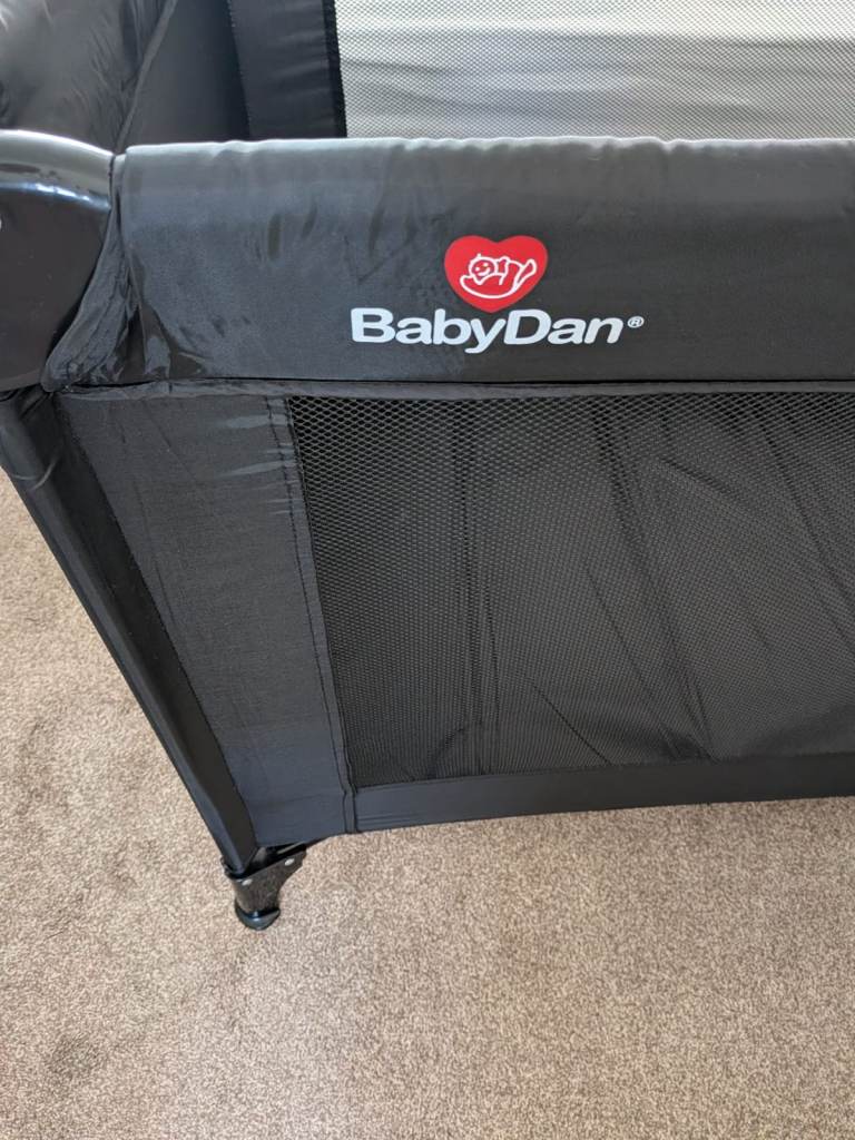 Brand new baby dan travel cot