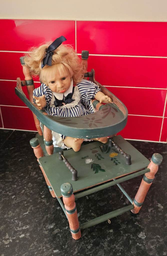 Beautiful vintage dolls chair with doll. Metamorphic, retro