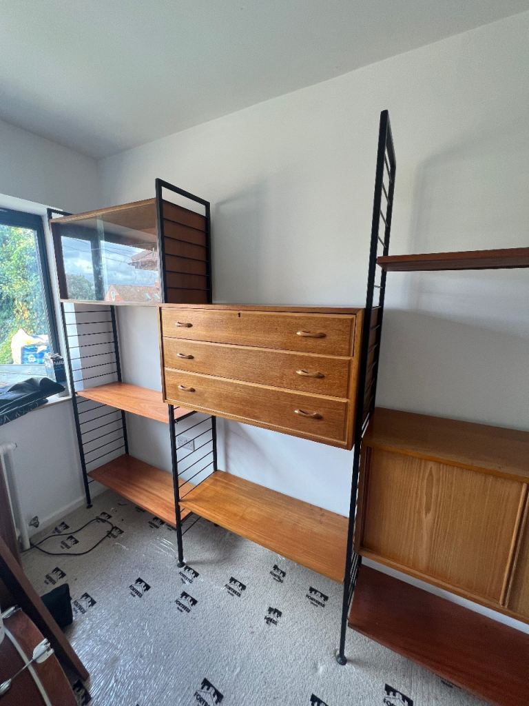 Triple bay of mid century Ladderax shelving 