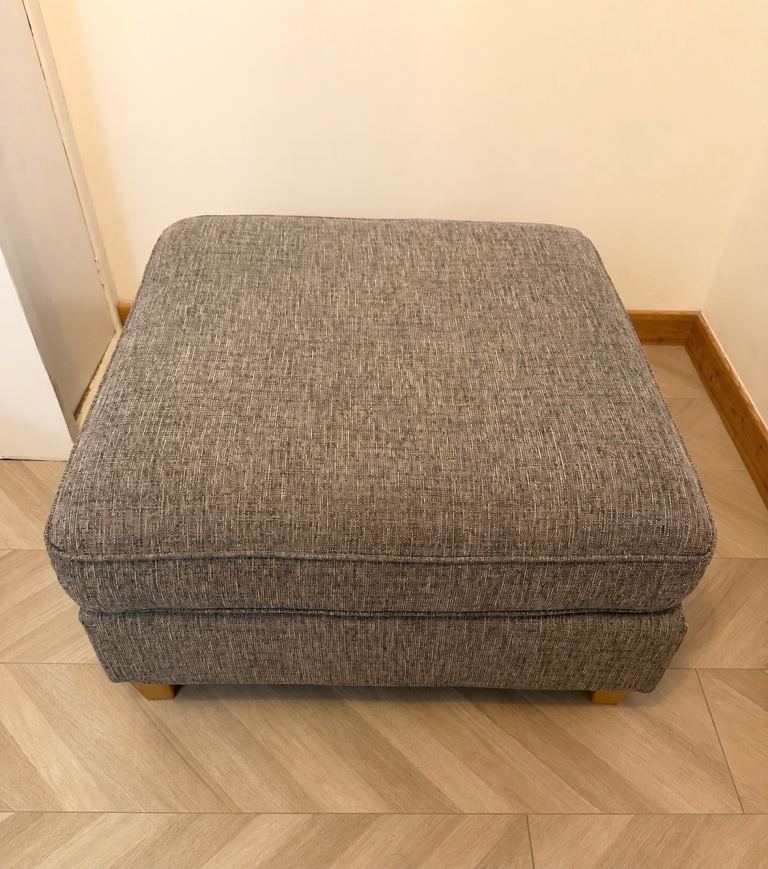 Grey fabric pouffe 