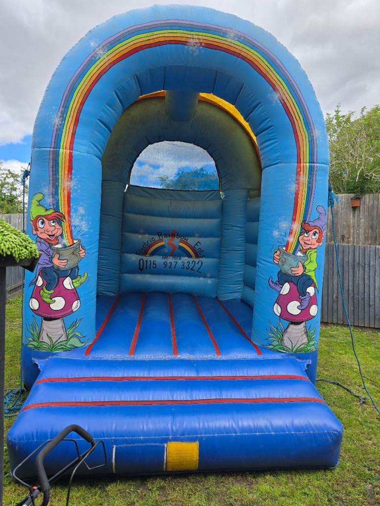 Large Inflatable Bouncy Castle with Rainbow & Elf Design – Good Condition