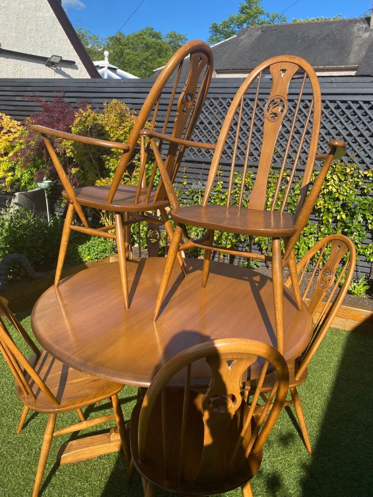 Ercol dining table & 6 swan back chairs 