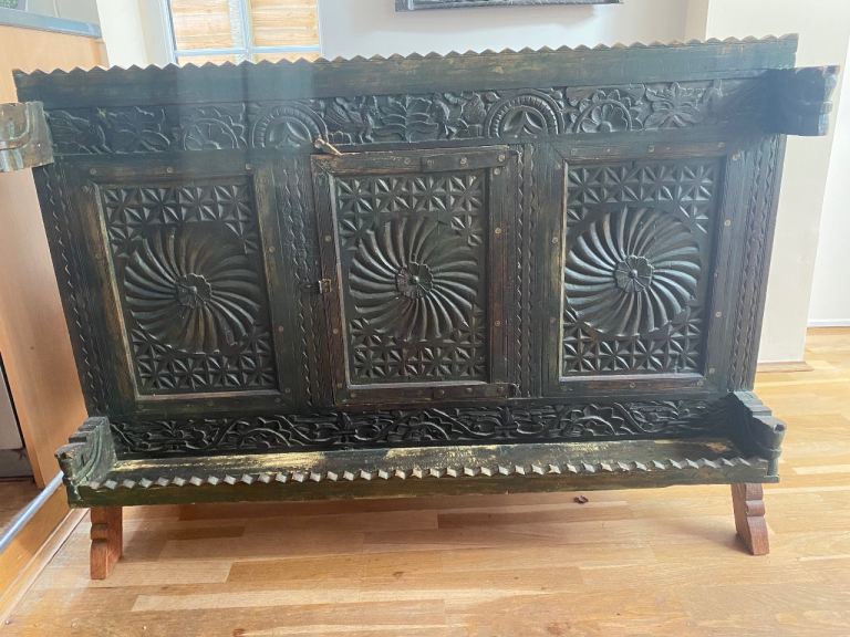 Rustic sideboard with wood carvings 