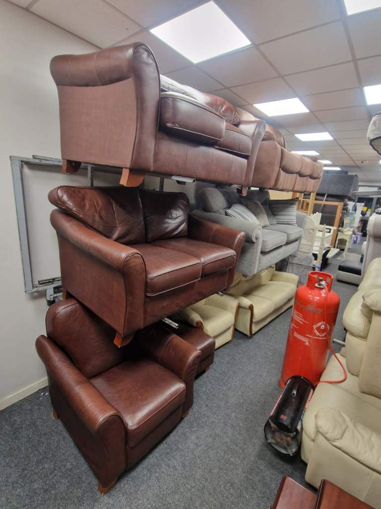 2 2 seater sofa and armchair and footstool in a tan leather hype throughout only £350
