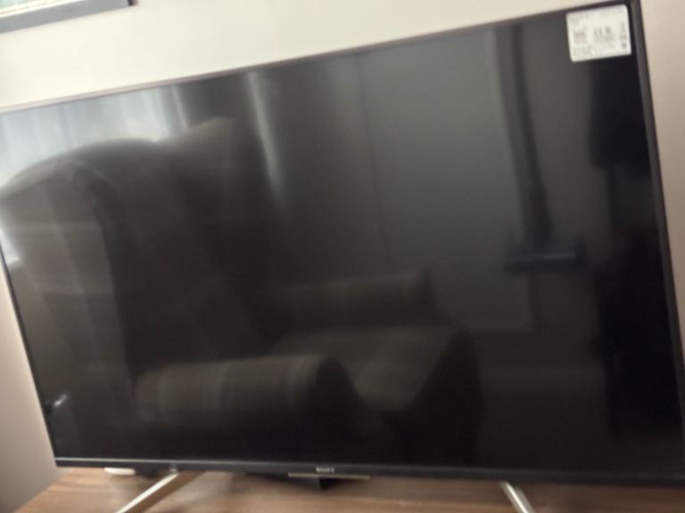 Tv cabinet with 43 inch Sony smart TV, Morden high back chair