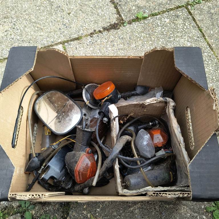 Box of Motorcycle Parts - Mirrors, Indicators, and More