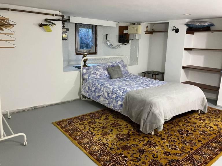 large basement room with double bed 