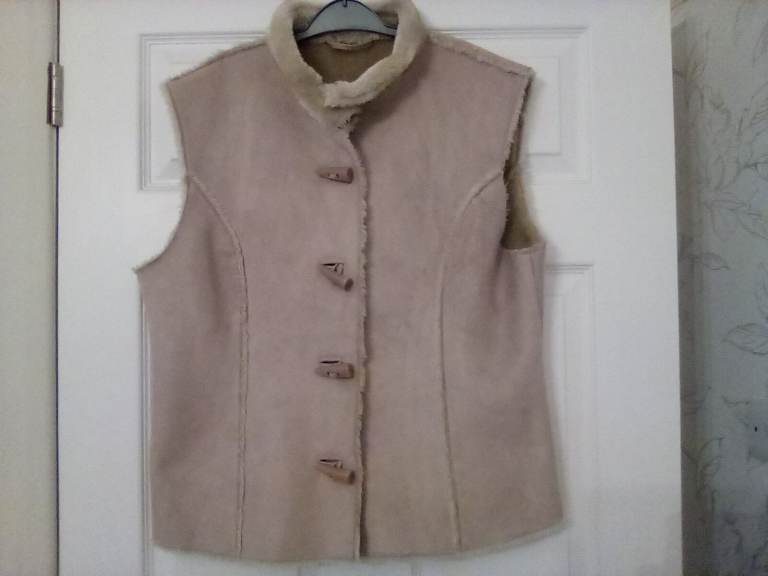 Suede body warmer with fur lining. Multi size. Very warm. New.