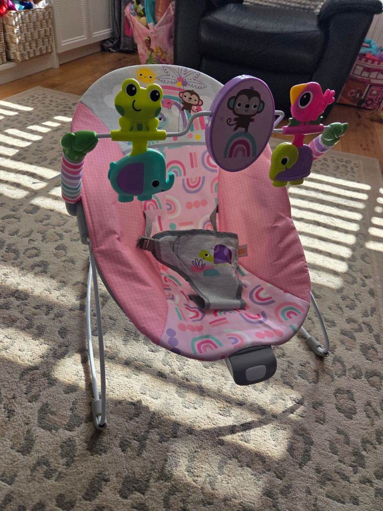 Pink baby bouncer with vibration